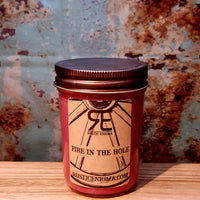 Fire in the Hole handmade western candle — bold red-hot cinnamon soy candle in 8 oz jelly jar, Rustic Enigma New Mexico